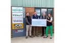 Stephen Dennis accepting the cheque from the Redlynch team.