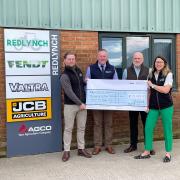 Stephen Dennis accepting the cheque from the Redlynch team.