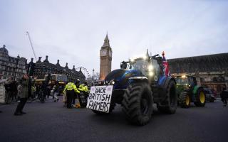 Farmers take part in a tractor 