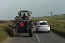 The extraordinary moment a driver overtakes a tractor - despite an oncoming car