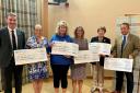 Charities received cheques from Cornwall YFC during their county AGM.