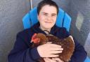 George smiled and made happy sounds whenever he saw chickens, so the family adopted five