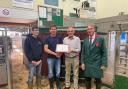 Record breaker – (L-R) Martin Pratt and his son, Edward, from Honiton, with John Gardener, who bought the heifer on behalf of a client, with auctioneer, Derek Biss