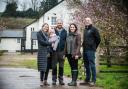 Clare James and her colleague Sam Briant-Evans with new tenant farmer Ollie White and his partner Charlotte and daughter Poppy