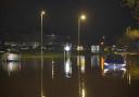 The scene at midnight in Wiltshireon the Bradford Road and Brook Road roundabout with cars stuck in the flood water.