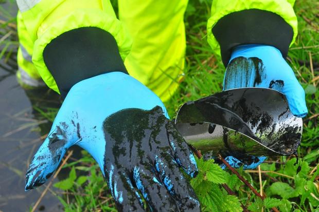 Black sludge which coated the River Inny for three miles in the summer of 2018. Picture: Environment Agency