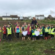 Shells Class from Mullion Primary School visit Tregullas Farm to bury some large pants!