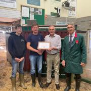 Record breaker – (L-R) Martin Pratt and his son, Edward, from Honiton, with John Gardener, who bought the heifer on behalf of a client, with auctioneer, Derek Biss