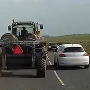 The extraordinary moment a driver overtakes a tractor - despite an oncoming car