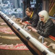 Axminster Carpets staff Emma Tytherleigh and Leann Guppy quality check to ensure perfection and hand stitch any tufts to finish the carpet. National Trust_Steve Haywood.