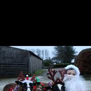 Santa, elf and their 'reindeer'.